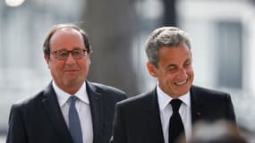 L'ancien président français François Hollande (G) et l'ancien président français Nicolas Sarkozy assistent à une cérémonie marquant la fin de la Seconde Guerre mondiale à l'Arc de Triomphe à Paris, le 8 mai 2020