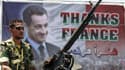 Affiche représentant Nicolas Sarkozy, début juillet à Benghazi. Le président français est attendu jeudi en Libye en compagnie du Premier ministre britannique David Cameron, selon une source proche du Conseil national de transition libyen (CNT). /Photo pri