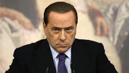 Le président du Conseil Silvio Berlusconi a été innocenté mardi par un juge milanais des charges de fraude fiscale et d'abus de confiance liées au dossier Mediatrade, filiale de son groupe Mediaset. /Photo prise le 12 août 2011/REUTERS/Remo Casilli