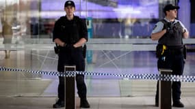 Policiers à l'aéroport de Canberra, en Australie, le 14 août 2022