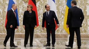 Le président russe Vladimir Poutine, la chancelière allemande Angela Merkel, le président français Francois Hollande et le président ukrainien Petro Poroshenko à Minsk, mercredi 11 février 2015