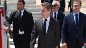 Nicolas Sarkozy, accompagné de Luc Chatel, à Rabat, au Maroc, le 22 juin.