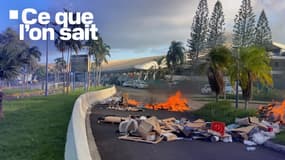 Une voiture en flammes près de l'aéroport Aimé-Césaire en Martinique, dans le cadre des manifestations contre la vie chère, le 10 octobre 2024
