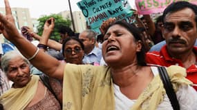 Une femme crie son désespoir lors d'une manifestation contre les violences faites aux femmes en Inde, en 2013.