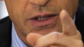 Nicolas Sarkozy s'est efforcé mercredi de rassurer les députés UMP inquiets des velléités présidentielles de Jean-Louis Borloo, déclarant que tous ceux qui avaient tenté leur chance en dehors de leur famille politique d'origine avaient échoué. /Photo d'ar