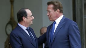 François Hollande et Arnold Schwarzenegger  à l'Elysée en 2014
