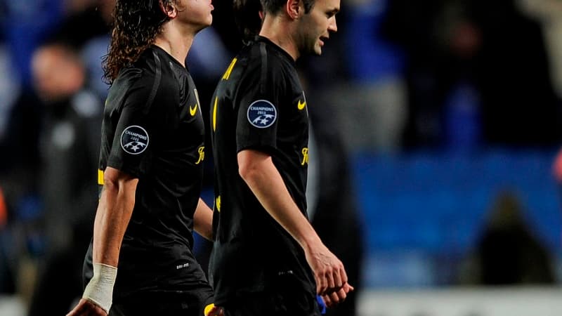 Carles Puyol et Andres Iniesta