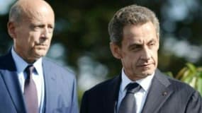 Le maire de Bordeaux Alain Juppé et l'ex-président Nicolas Sarkozy, le 5 septembre 2015 à La Baule