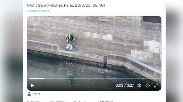 Sur l'image, l'agent est en train de déverser des déchets dans la Seine ce mercredi 28 juin 2023 à Paris. 