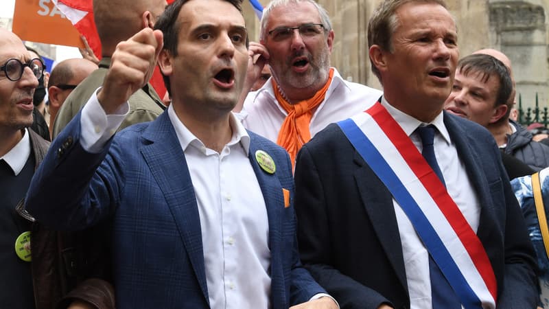 Florian Philippot et Nicolas Dupont-Aignan en manifestation contre le pass sanitaire à Paris, le 17 juillet 2021