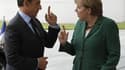 Angela Merkel et Nicolas Sarkozy à Berlin, le mois dernier. Très majoritairement inquiets face à la crise, les Français font davantage confiance à la chancelière allemande qu'à leur propre président pour la résoudre, selon un sondage publié jeudi. /Photo