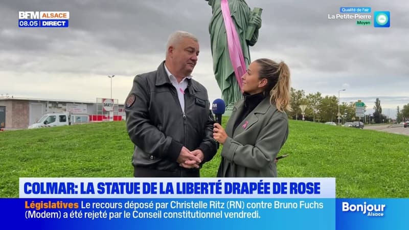 “Ça parle à tout le monde” : Éric Straumann, maire de Colmar, commente l’installation d’une écharpe rose sur la statue de la Liberté pour Octobre Rose